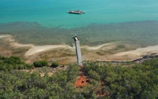 Aerial view of pier leading into the ocean