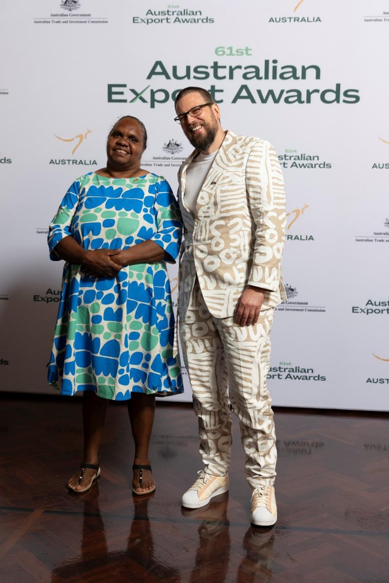 Australian consular officials decked out with Indigenous artist designs