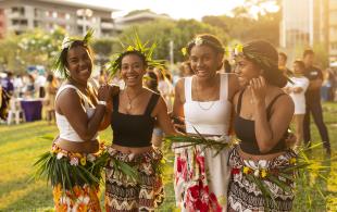 Women dressed in traditional outfits at cultural festival