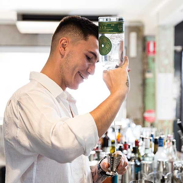 Young man pouring a drink