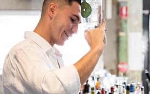 Young man pouring a drink