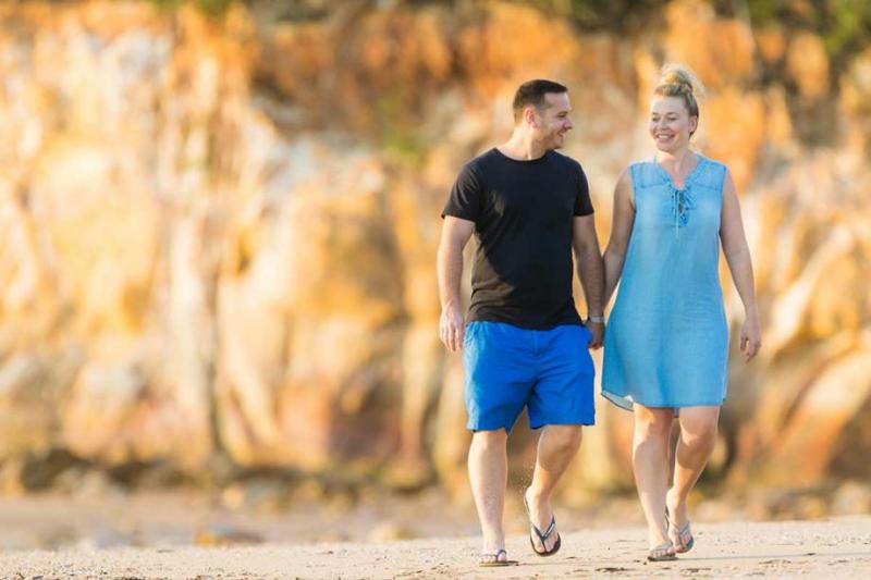 Couple walking along a beach